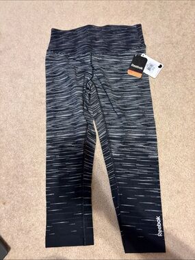 Reebok women’s Black and Heathered Gray Performance capri Leggings